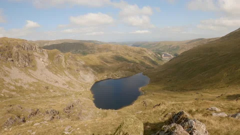 Time Lapse View Looking Down Over Small Water Tarn Towards Haweswater Reservo Stock Footage 162663950