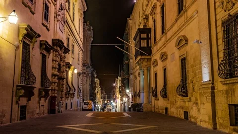 Time lapse view of Merchant street in Valletta, Malta, at night Stock Footage 106915808