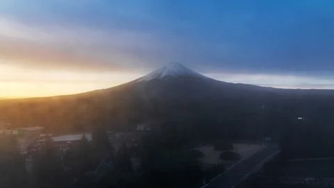 Time lapse view of Mount Fuji during sunrise with moving clouds Stock Footage 295735069