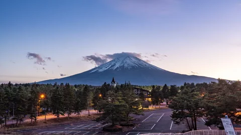 Time lapse view of Mount Fuji during sunset with moving clouds Stock Footage 295735875