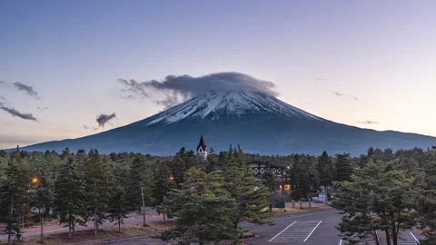 Time lapse view of Mount Fuji during sunset with moving clouds Stock Footage 295735915