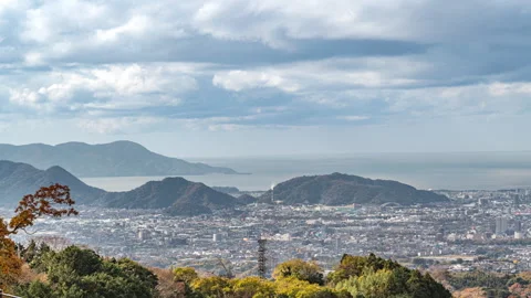 Time lapse view of the ocean and Mishima city Stock Footage 295735072