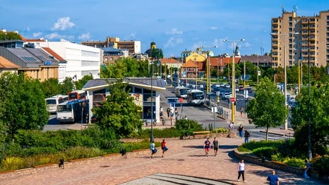 Time-lapse view on the people and the busy streets and bus station of Stock Footage 114224642
