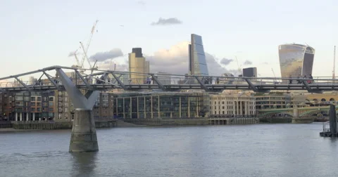 Time lapse view of people crossing the Millennium bridge Stock Footage 68986142
