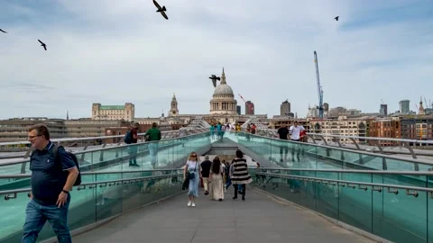 Time lapse view of people walking over the Millenium Bridge in London Stock Footage 231886307
