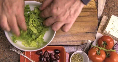 Time lapse view of the preparation of a fresh, healthy, organic greek salad Stock Footage 72178643