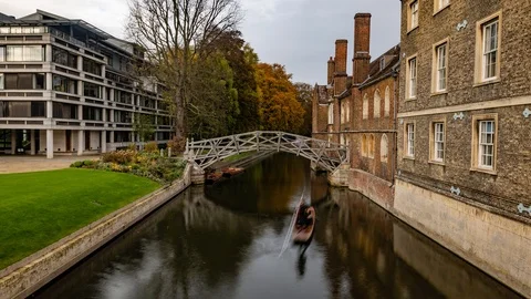 Time lapse view of punting under the mathematical bridge in Cambridge Stock Footage 100981177