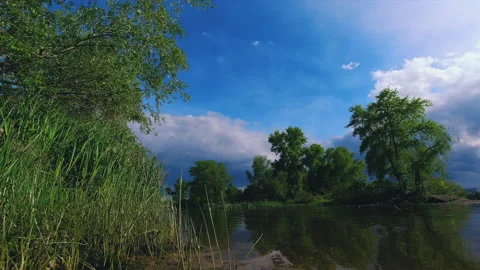 Time Lapse view of the river and the clouds running above it before the rain Stock Footage 130794963