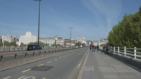 Time lapse.  A view of roads and sidewalks on a city bridge. Stock Footage 189968316