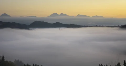 Time lapse view of Saint Thomas church with fog in valley Stock Footage 120479169