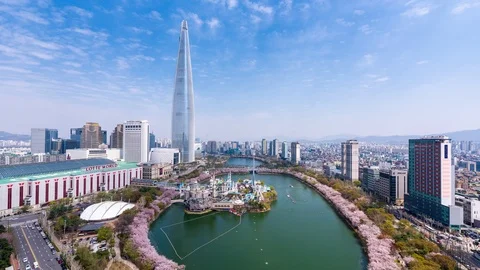 Time lapse View of Seokchon lake park and Lotte World Tower in spring. Stock Footage 107326271
