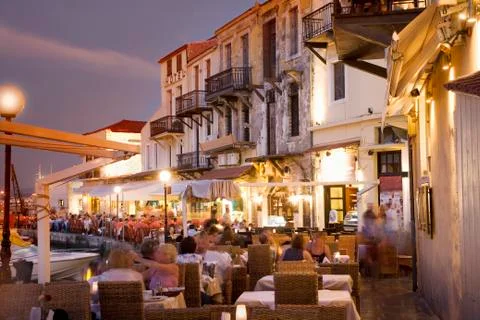 Time lapse view of sidewalk cafe at sunset, Mykonos, Cyclades, Greece Stock Photos
