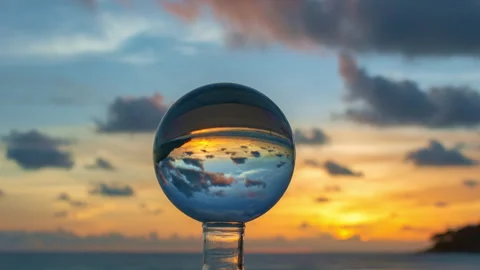 .Time lapse view of the sunset inside the Crystal Ball at the beach. Stock Footage 277789809
