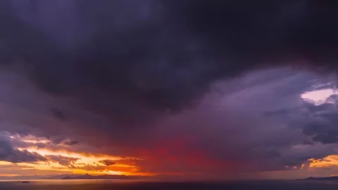 Time lapse view of a sunset sky with intense, red colour Stock Footage 320389549