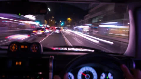 Time lapse of view through front window driving in city at night 135GYND NTSC Stock Footage 26440218