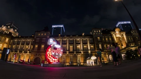 Time lapse view of the Tokyo Olympic timer at the Tokyo Station square at night Stock Footage 115373829