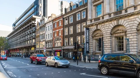 Time lapse view of traffic and bus stop in the busy Strand Street. City of Stock Footage 105525513