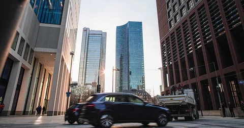 Time lapse view of traffic and pedestrians crossing busy intersection downtown Stock Footage 126609097