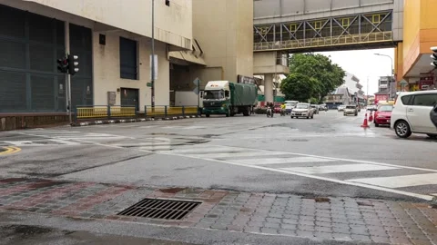 Time lapse view of traffic and pedestrians crossing busy intersection Stock Footage 131216967