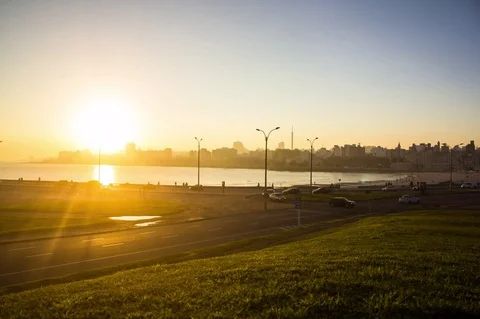 Time lapse view of traffic on waterfront streets at sunset Stock Footage 75185220