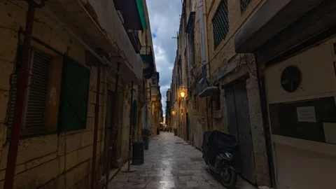 Time lapse view of a typical narrow lane in Valletta (Malta) before sunset Stock Footage 107195983