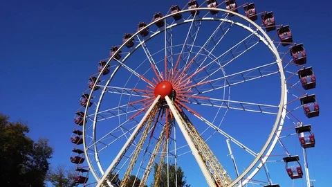 Time lapse view on vintage roller coaster amusement park ferris wheel rotating Stock Footage 102342958