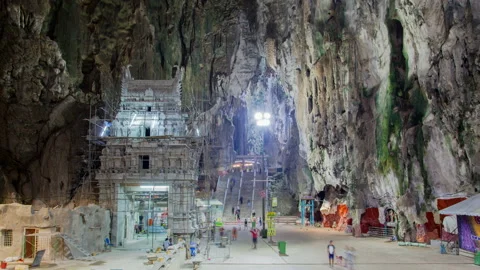 Time-lapse view of visitors pass by in the Batu Caves in Kuala Lumpur, Malaysia. Stock Footage 115058082