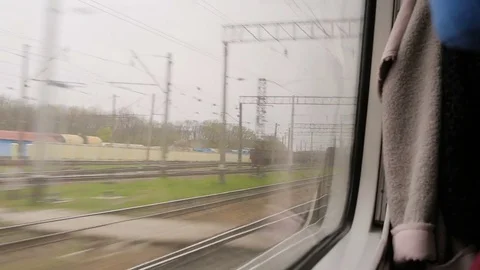 Time-lapse. View from the window of moving train. Green nature, sunny day. Stock Footage 81267313