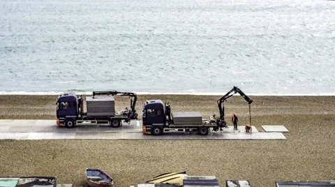 Time lapse view of workers on the beach Stock Footage 62342086