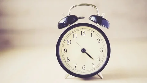 Time lapse Vintage background with retro alarm clock on table Stock Footage 83206163