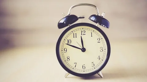 Time lapse Vintage background with retro alarm clock on table Stock Footage 83206186