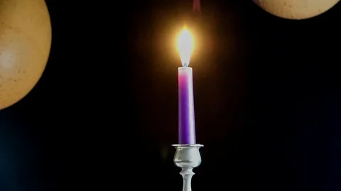 Time-lapse of a violet candle burning completely in a tin candlestick Stock Footage 123713057