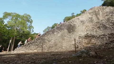 Time-Lapse of visitors climbing the Mayan Temple at the Coba Ruins, Mexico - 2 Stock Footage 84069638