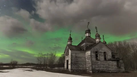 Time lapse of vivid green Aurora plus stars above an abandoned orthodox church Stock Footage 142092043