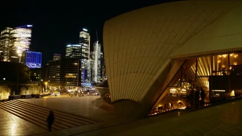 Time lapse VIVID Skyscrapers opposite Sydney Opera House at night 4K Video stock 310399656