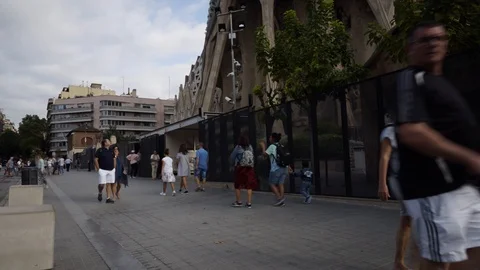 Time Lapse of walking people in front of Sagrada Familia's passion façade Stock Footage 96334147