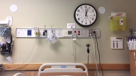 Time-lapse of wall clock in empty hospital room, static shot. Stock Footage 151811602