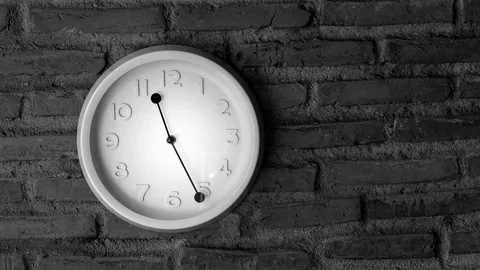 Time lapse of a wall clock with rustic wall in the background - travelling. Stock Footage 79604002
