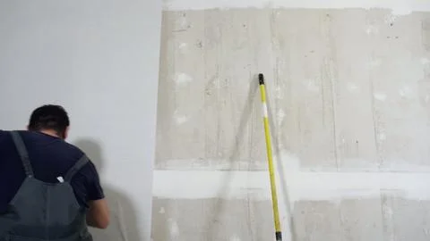 Time lapse of wallpapering in the room. Stock Photos