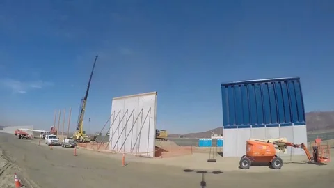 Time lapse of walls being built with heavy equipment Stock Footage 111849074