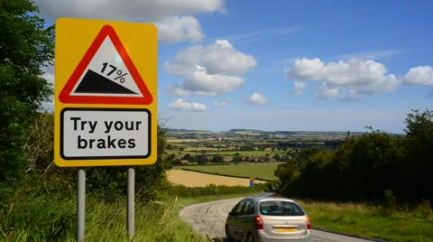 Time lapse warning sign of test your brakes on staxton hill scarborough uk Stock Footage 53020416