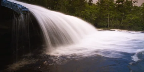 Time-lapse of waterfall flowing over the rock Stock Footage 103821124