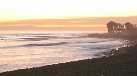 Time lapse of waves, boat and surfers at Ventura Point after sunset in Ventura Stock Footage 1019412