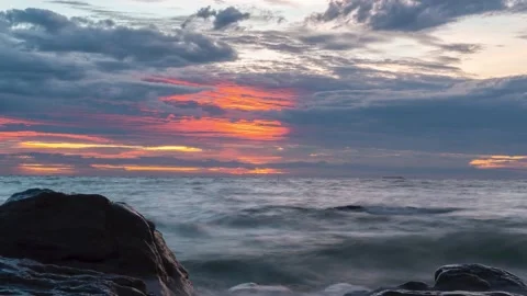 Time lapse waves hit on the rock in sunset at beach, sunset cloud over the sea Stock Footage 162705292