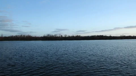Time Lapse of Waves Lapping By During Sunset By Lake Video stock 1327641
