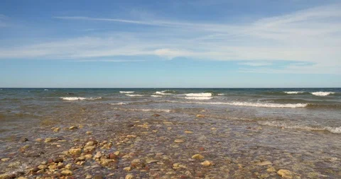 Time lapse of waves on a rocky sandbar in the sea Stock Footage 101742041