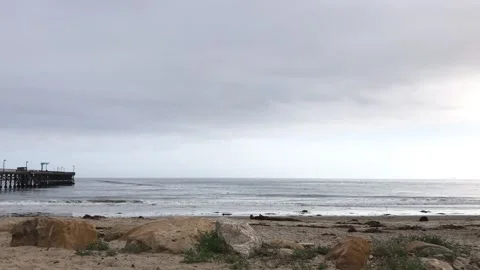 Time Lapse Waves Roll Into the Beach On A Gray Day In Over Rated Zip Code Video stock 174369713