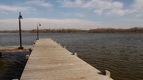 Time Lapse Waves Rushing By Next To Wooden Pier Video stock 1183828
