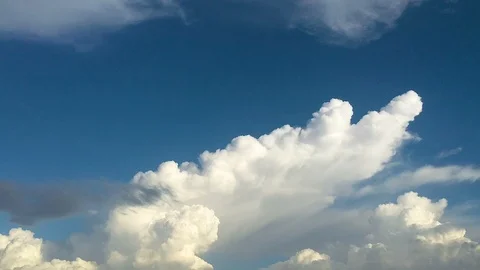 Time-lapse of the white big cloud transforming with the wind during sunset Stock Footage 90988040