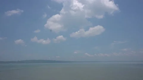 Time lapse white bright clouds in the blue sky weather above the sea 스톡 동영상 229923262